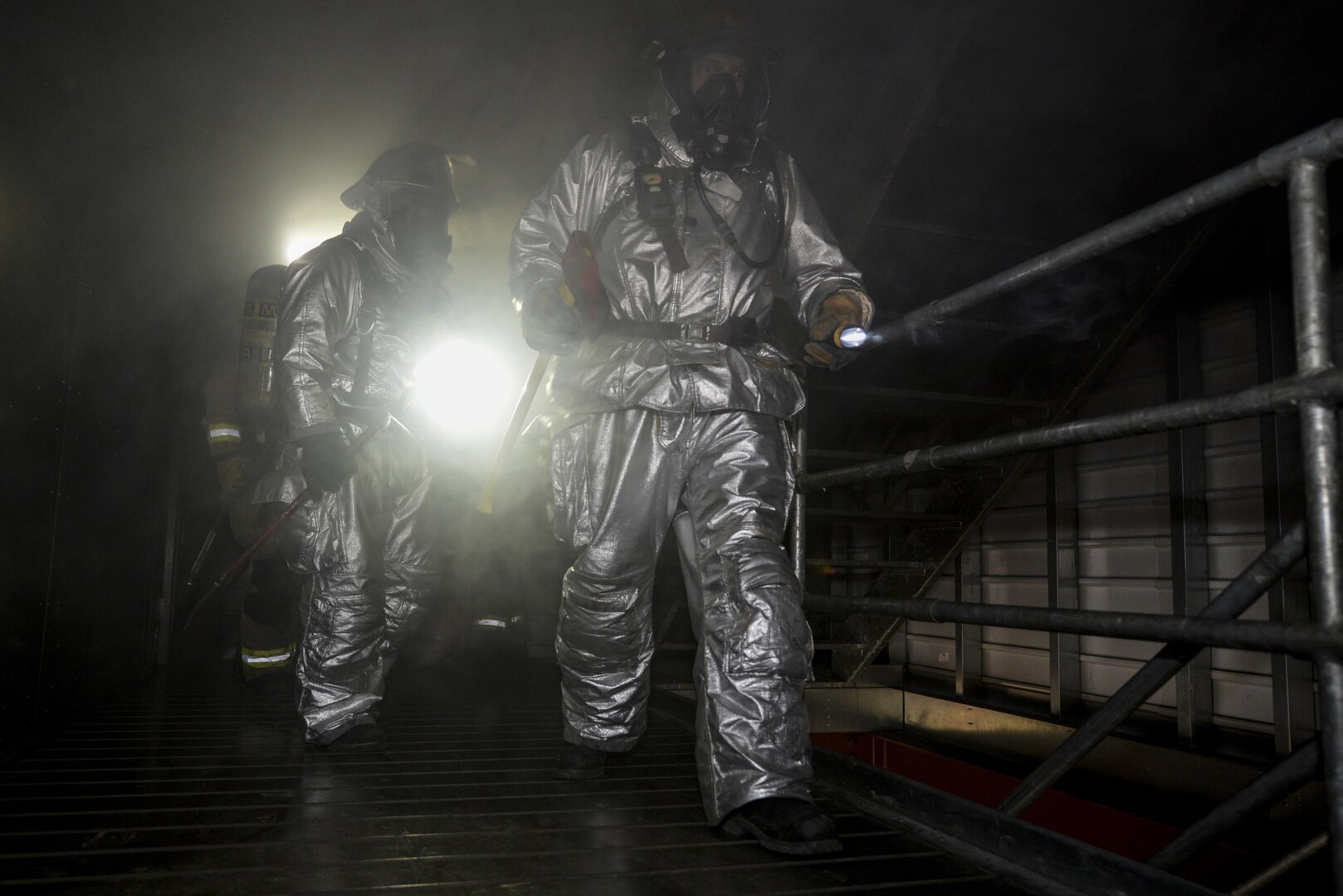 502nd Civil Engineer Squadron firefighters practice search and rescue techniques Nov. 17, 2015, at the Joint Base San Antonio-Fort Sam Houston burn building. Firefighters from JBSA-Randolph, Lackland, Fort Sam Houston and Bexar County combined to review basic firefighting techniques including ladder rescue, emergency medicine, search and rescue and how to quickly suppress and extinguish a house fire. (U.S. Air Force photo by Airman 1st Class Stormy Archer/Released)