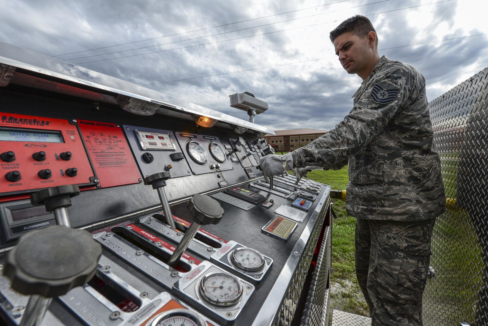 Tech. Sgt. William Everett, 502nd Civil Engineer Squadron firefighter, operates a fire engine pump panel Nov. 17, 2015, at Joint Base San Antonio-Fort Sam Houston, Texas. Firefighters from JBSA-Randolph, Lackland, Fort Sam Houston and Bexar County combined to review basic firefighting techniques including ladder rescue, emergency medicine, search and rescue and how to quickly suppress and extinguish a house fire.(U.S. Air Force photo by Airman 1st Class Stormy Archer/Released)