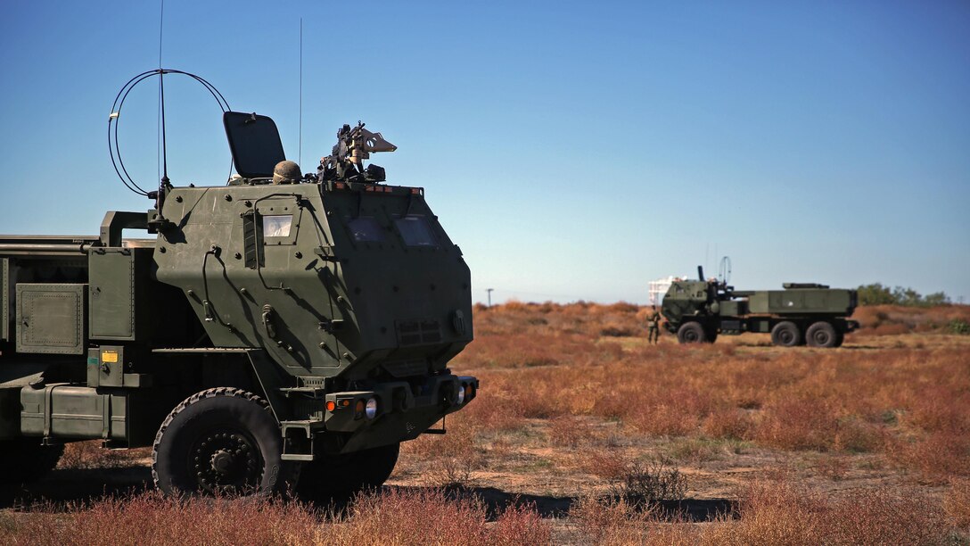 Marines assigned to Battery Q, 5th Battalion, 11th Marine Regiment, 1st Marine Division, stand ready to employ the High Mobility Artillery Rocket System during the 5/11 Command Post Exercise aboard Marine Corps Base Camp Pendleton, Calif., Nov. 18, 2015. The CPX provided an opportunity for the Marines to refresh their skillsets in preparation for exercise Steel Knight 2016.
