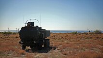 Marines assigned to Battery Q, 5th Battalion, 11th Marine Regiment, 1st Marine Division, stand ready to employ the High Mobility Artillery Rocket System during the 5/11 Command Post Exercise aboard Marine Corps Base Camp Pendleton, Calif., Nov. 18, 2015. The CPX provided an opportunity for the Marines to refresh their skillsets in preparation for exercise Steel Knight 2016. 