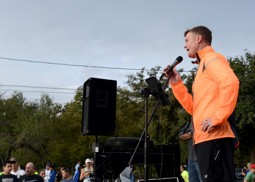 Col. Thomas Shank, 47th Flying Training Wing commander, speaks to participants at the Running with the Bulls 5k/10k in Del Rio, Texas, Nov. 14, 2015. The race is one of many ways that Laughlin Air Force Base and Del Rio come together to support the community, and this event helps raise money and food for a local food bank. (U.S. Air Force photo by Senior Airman Jimmie D. Pike)