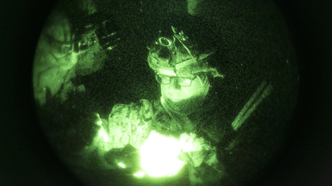 Lance Cpl. Jose Miramantes, rifleman, Company F, 2nd Battalion, 7th Marine Regiment, plans an ambush at Range 215 while acting as part of the opposing forces in a movement-to-contact training mission, Operation Watchtower, Nov. 9, 2015. The exercise provided the Marines an opportunity to better themselves securing areas and locating opposing forces, as well as enabling the leaders of the various teams with the ability to make crucial decisions in the fog of war.