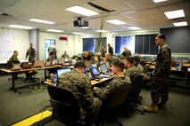 Marines with 1st Marine Division take part in a Combined Armed Staff Trainer exercise aboard Marine Corps Base Camp Pendleton, Calif., Nov. 17, 2015, in preparation for Exercise Steel Knight 2016. The CAST exercise was a division-level evolution, which allowed Marines to maintain designated skillsets in support of a simulated, large-scale operation.(U.S. Marine Corps photo by Cpl. Demetrius Morgan/RELEASED)