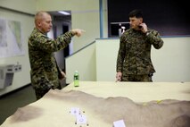 Marines with 1st Marine Division take part in a Combined Armed Staff Trainer exercise aboard Marine Corps Base Camp Pendleton, Calif., Nov. 17, 2015, in preparation for Exercise Steel Knight 2016. The CAST exercise was a division-level evolution, which allowed Marines to maintain designated skillsets in support of a simulated, large-scale operation.(U.S. Marine Corps photo by Cpl. Demetrius Morgan/RELEASED)