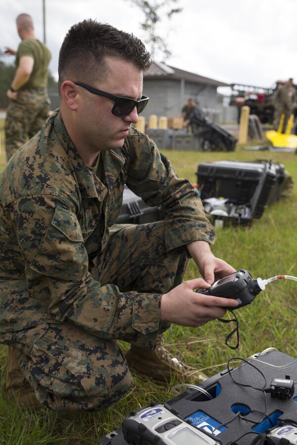 Lance Cpl. Nicholas J. Roach, chemical, biological, radiological and nuclear defense specialist with CBRN platoon, Combat Logistics Regiment 4, 4th Marine Logistics Group, calibrates his detectors before conducting CBRN training at Camp Shelby, Miss., Nov. 17, 2015 as part of a week-long Advanced Consequence Management course. Multiple detectors are used by the CBRN defense specialists that detect everything from subtle changes in the environment to the presence of weapons of mass-destruction. (U.S. Marine Corps photo by Cpl. Ian Leones/Released)