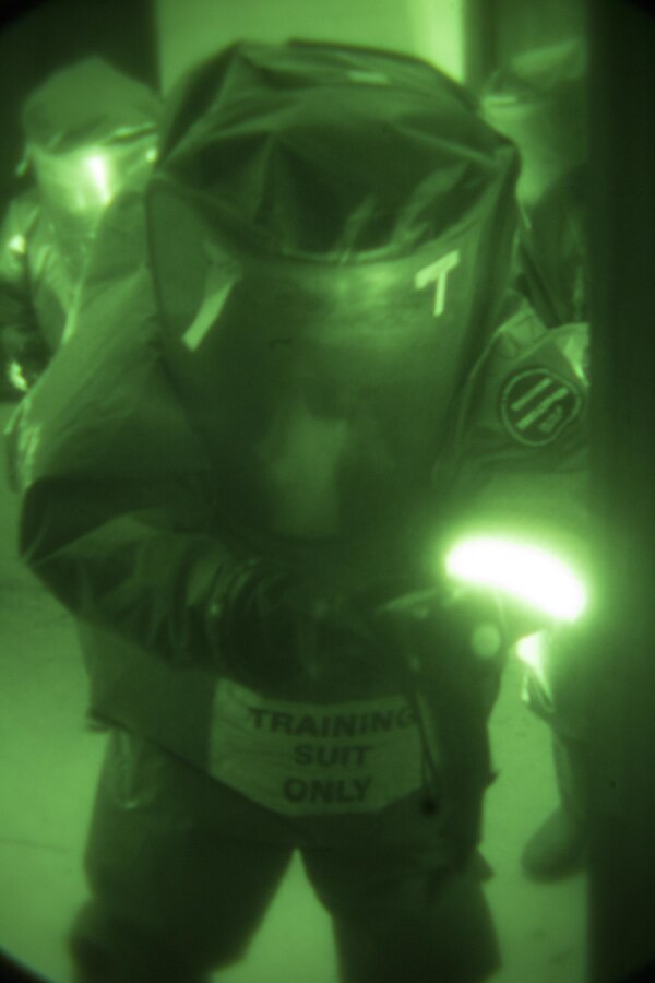 Lance Cpl. Alex Cruz, chemical, biological, radiological and nuclear defense specialist with 4th Reconnaissance Battalion, 4th Marine Division, scans for hazardous materials as part of a CBRN reconnaissance team during a low-light training scenario at Camp Shelby, Miss., Nov. 17, 2015. Marines from across Marine Forces Reserve conducted CBRN training scenarios as part of a week-long Advanced Consequence Management course. (U.S. Marine Corps photo by Cpl. Ian Leones/Released)