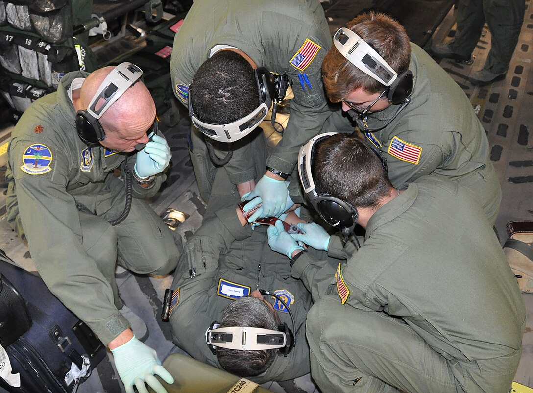 During an off station exercise for the 315th Aeromedical Evacuation Squadron. Master Sgt. Johnny Gomez played the part of a Soldier returning to Afghanistan after multiple deployments. This scenario was to gauge how the AE members would react when the Soldier had an anxiety attack midair and eventually became combative. The patient was successfully restrained to keep him from harming himself or others on the jet. (U.S. Air Force Photo by 2nd Lt. Chris Long)