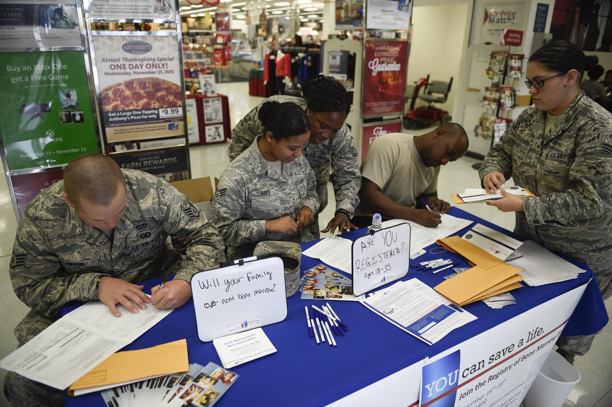 Air Commandos fill out forms during a bone marrow donor drive at Hurlburt Field, Fla., Nov. 17, 2015. The forms will be used to add Department of Defense members to the National Marrow Donor program. (U.S. Air Force photo by Airman Kai White)