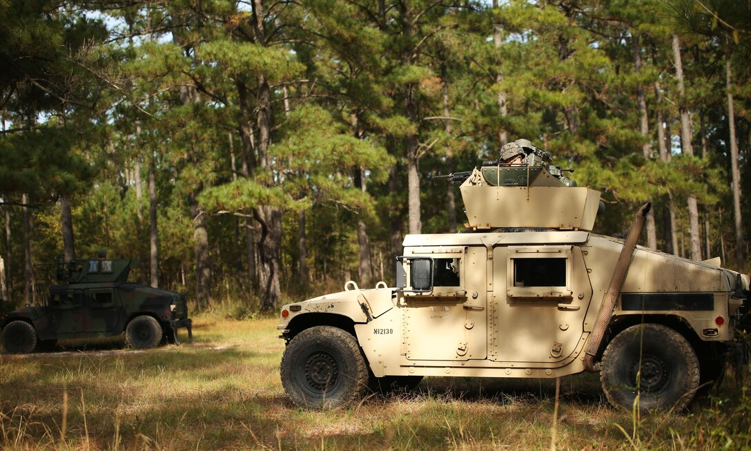 Marines with Combined Anti-Armor Team, 3rd Battalion, 2nd Marine Regiment, conduct patrols during a patrol training exercise at Camp Lejeune, N.C., Nov. 16, 2015. The unit practiced patrolling techniques both on foot and mounted in Humvees in preparation for their upcoming deployment to Okinawa, Japan. (U.S. Marine Corps photo by Lance Cpl. Brianna Gaudi/Released)