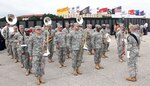 The 323rd Army Band “Fort Sam’s Own,” under the leadership of Band Master Chief Warrant Officer 4 Thomas Hager, gets ready to perform during the “Salute To Veterans” event at MacArthur Field on Fort Sam Houston Friday, which honored veterans past and present for their service. The drum major is Sgt. 1st Class Luke Jefferson.