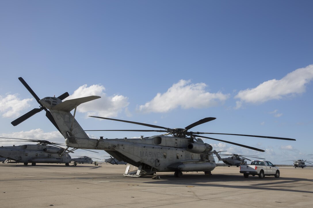 A CH-53E Super Stallion with Marine Heavy Helicopter Squadron (HMH) 465 “Warhorse” waits on the flight line aboard Marine Corps Air Station Miramar, Calif., Nov. 16. Marines with HMH-465 will conduct aerial gun shoots, fire bucket training and terrain flights over the course of five days in El Centro, Calif. (U.S. Marine Corps photo by Sgt. Lillian Stephens/Released)