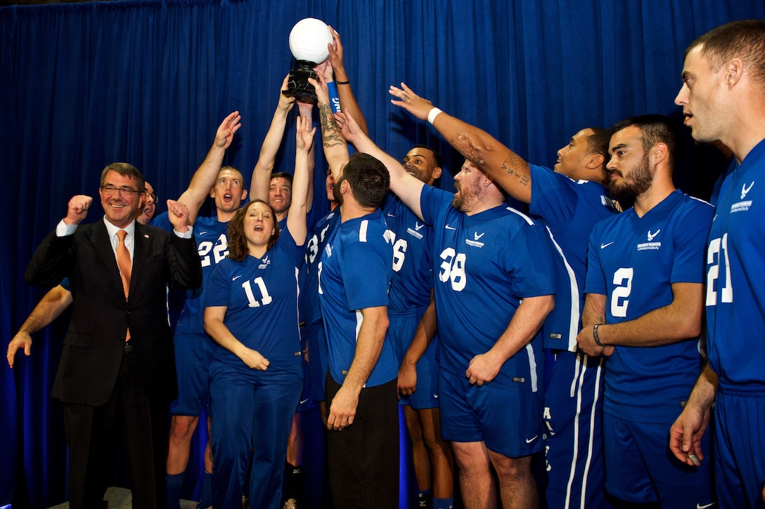 Defense Secretary Ash Carter celebrates with Team Air Force at the Warrior Care Month Sitting Volleyball Tournament at the Pentagon, Nov. 19, 2015. DoD photo by EJ Hersom