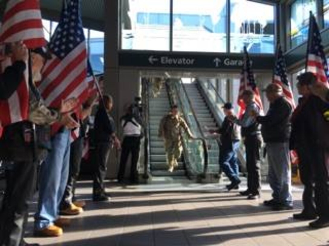Members of 45th and 55th Aerial Port Squadrons returned from deployment in Southwest Asia supporting Operation Inherent Resolve Nov. 18, 2015. The Airmen were greeted by friends and family at Sacramento International Airport. The Patriot Guard Riders of Northern California were also on hand to welcome the returning warriors. (Courtesy photos by Danielle Eaton)
