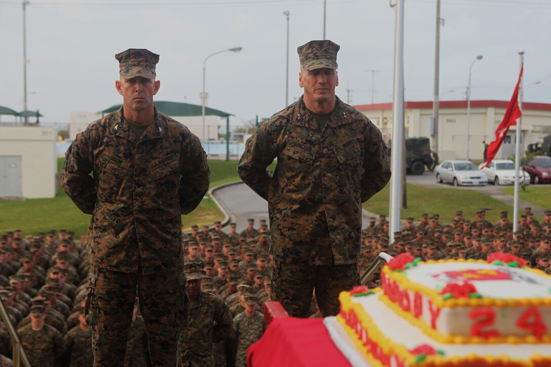 Col. David L. Odom, left, stands with Maj. Gen. Richard L. Simcock before a cake cutting ceremony Nov. 10 aboard Camp Schwab, Okinawa, Japan. Approximately 1,800 Marines present for the ceremony. Odom is the commanding officer of 4th Marine Regiment, 3rd Marine Division, III Marine Expeditionary Force. Simcock is the commanding general of 3rd Marine Division, III MEF. (U.S. Marine Corps Photo by Lance Cpl. Douglas D. Simons/Released)