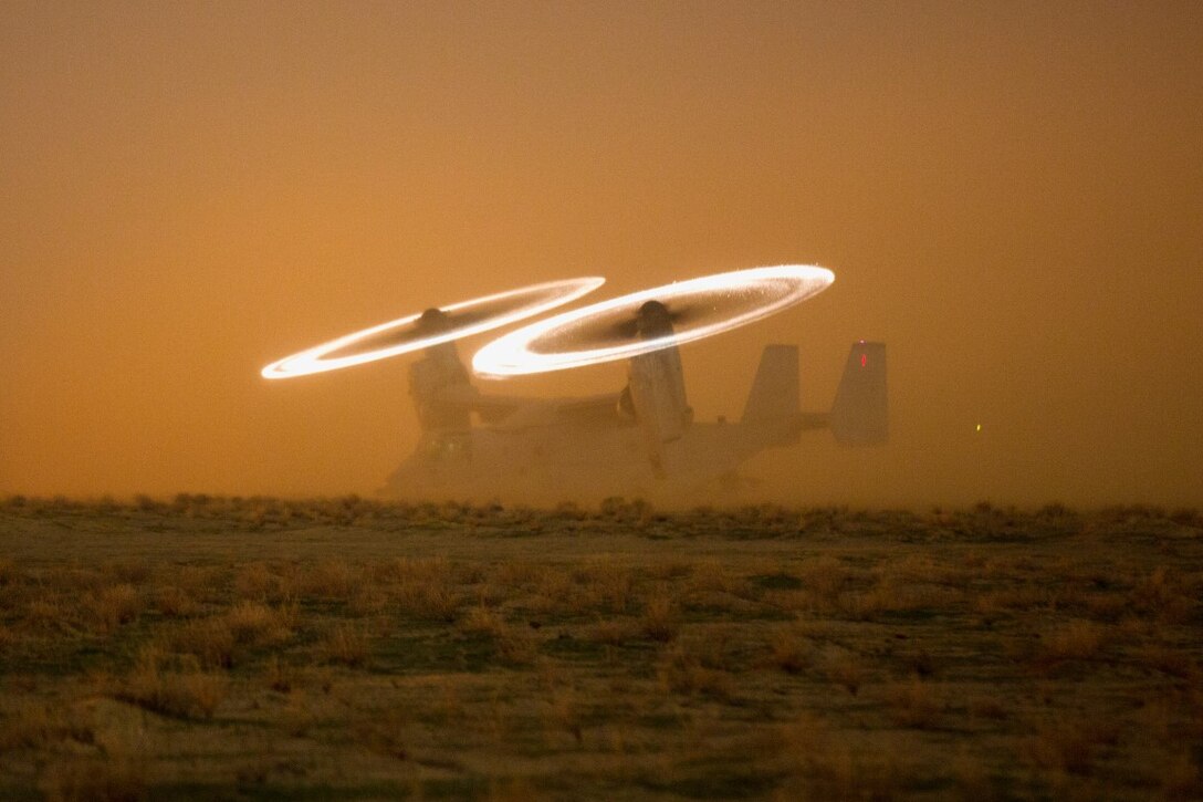 A U.S. Marine Corps MV-22 Osprey assigned to Special Purpose Marine Air-Ground Task Force-Crisis Response-Central Command stages on a hasty landing zone during a tactical recovery of aircraft and personnel drill at an undisclosed location in Southwest Asia, Nov. 16, 2015. SPMAGTF-CR-CC is ready to respond to any crisis response mission in theatre to include the employment of a TRAP force. 