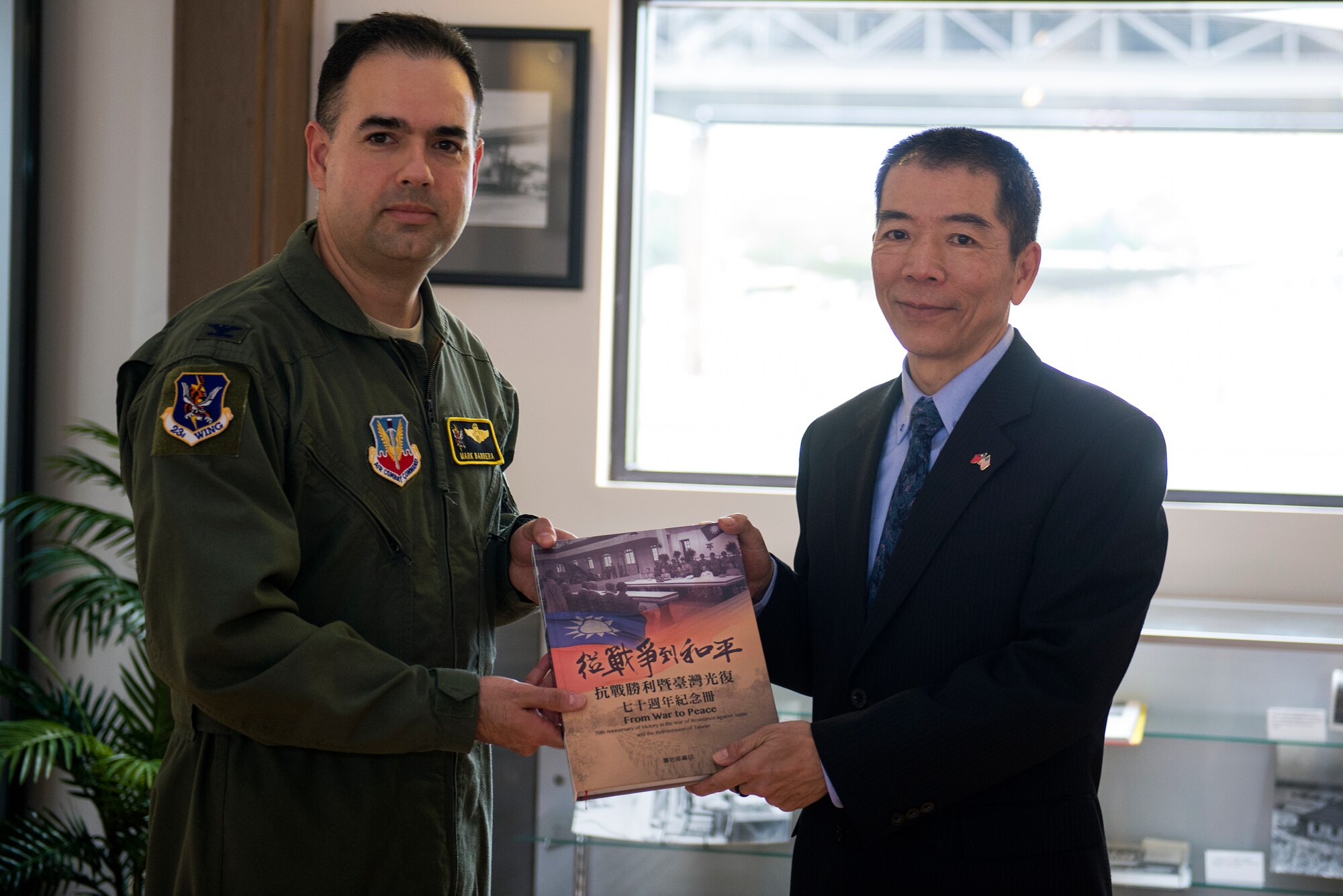 The Republic of China air force Lt. Gen. Liu Shou-Jen, presents U.S. Air Force Col. Mark Barrera, 23d Wing vice commander, a commemorative book during his visit, Nov. 18, 2015, at Moody Air Force Base, Ga. The book detailed Taiwan’s victory in the war of resistance against Japan where American armed forces helped the Chinese air force in World War II. (U.S. Air Force photo by Airman 1st Class Greg Nash/Released)