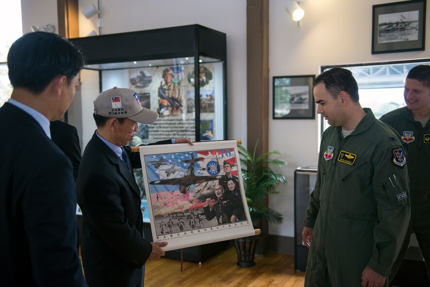 Republic of China air force Lt. Gen. Liu Shou-Jen presents U.S. Air Force Col. Mark Barrera, 23d Wing vice commander, a painting during his visit, Nov. 18, 2015, at Moody Air Force Base, Ga. The painting was a gift which commemorates the victory in the war of resistance against Japanese Invasion as the result of the ROC-USA Allied Operation. (U.S. Air Force photo by Airman 1st Class/Released)