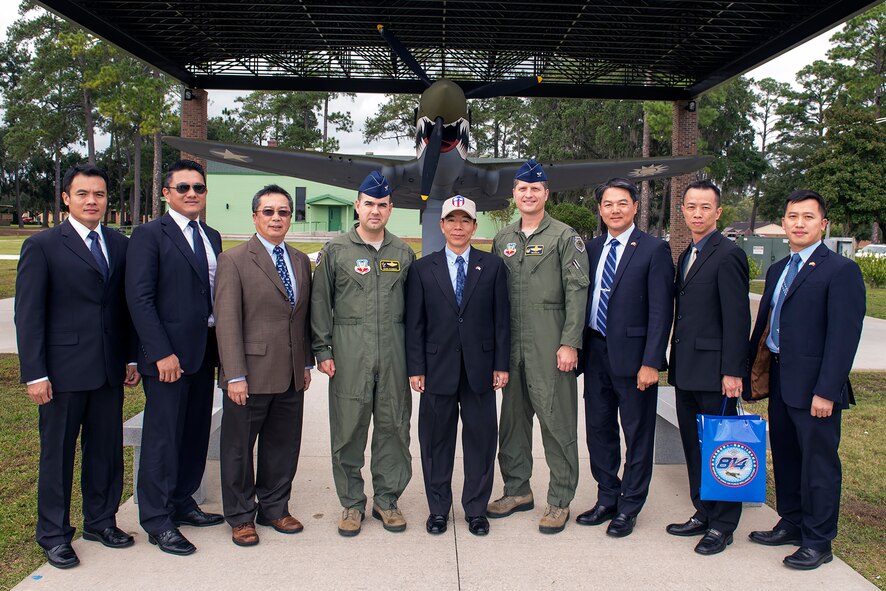 U.S. Air Force Col. Mark Barrera, 23d Wing vice commander, and Col. Timothy Sumja, 23d Fighter Group commander, pose in front of a Curtiss P-40 Warhawk with  Republic of China air force personnel, during ROCAF Lt. Gen. Liu Shou-Jen’s visit, Nov. 18, 2015, at Moody Air Force Base, Ga. The 23d Fighter Group’s A-10C Thunderbolt IIs took the “shark teeth’ nose art of the First American Volunteer Group’s Curtiss P-40 Warhawks to pay homage to the Flying Tiger pilots in World War II. (U.S. Air Force photo by Airman 1st Class Greg Nash/Released)