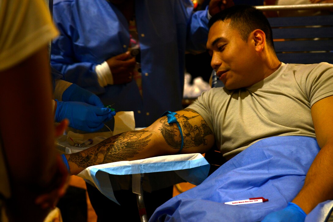 U.S. Army Spc. Nat Tan, Dwight D. Eisenhower Army Medical Center Bravo Company lab specialist, prepares to donate blood during an Armed Services Blood Program blood drive at Shaw Air Force Base, S.C., Nov. 18, 2015. The ASBP provides quality blood products and services for all recipients in both peacetime and war. The service is provided to all branches of the military to aid in war time efforts. (U.S. Air Force photo by Airman 1st Class Christopher Maldonado)