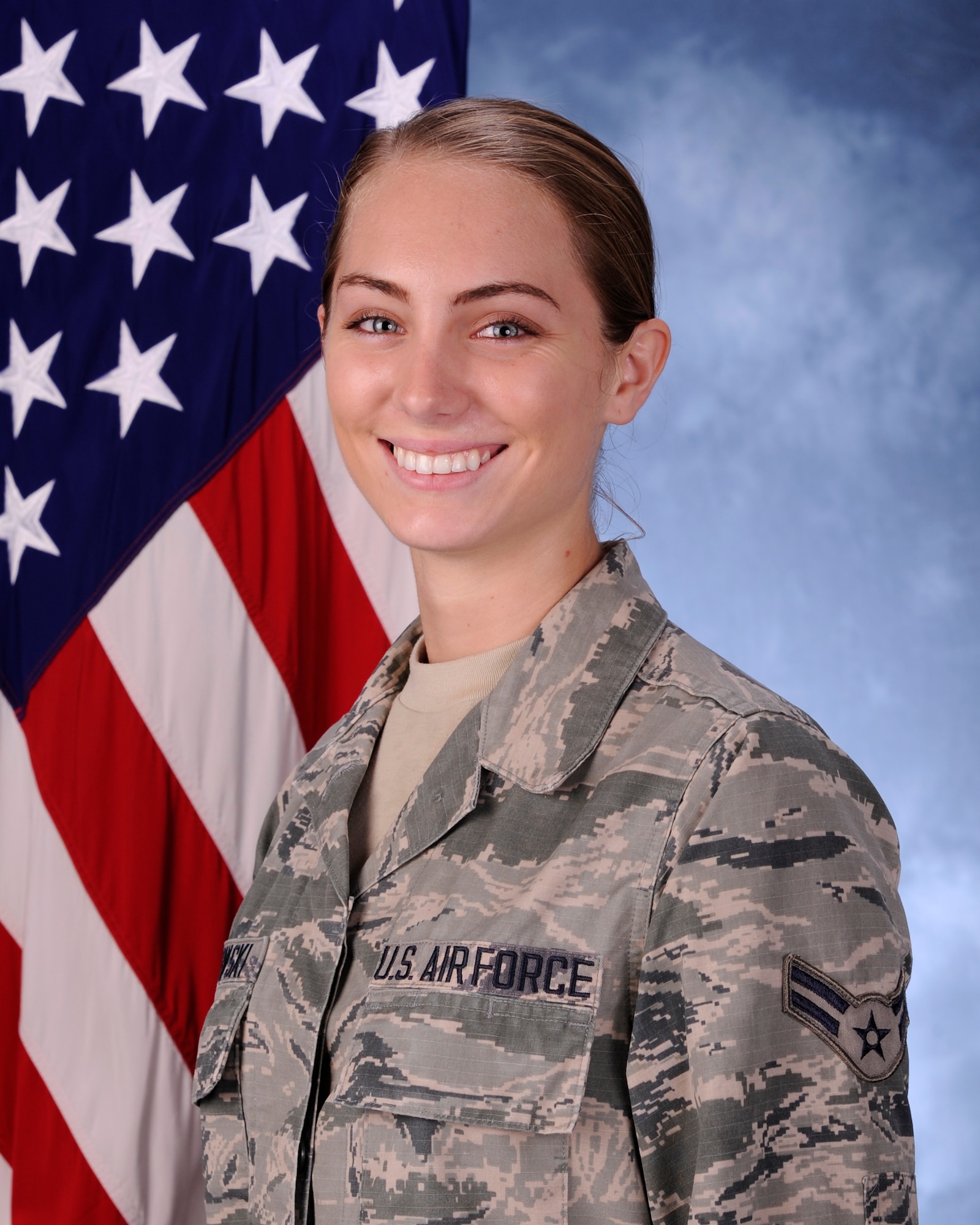 Airman 1st Class Brooke Piatkowski, 325th Operations Support Squadron Operations Intelligence apprentice poses for an official photo Nov. 18 at the Public Affairs Studio. Piatkowski was selected by 325th OSS leadership as the squadron’s Unsung Hero, a person that exemplifies what it means to be a part of their organization.