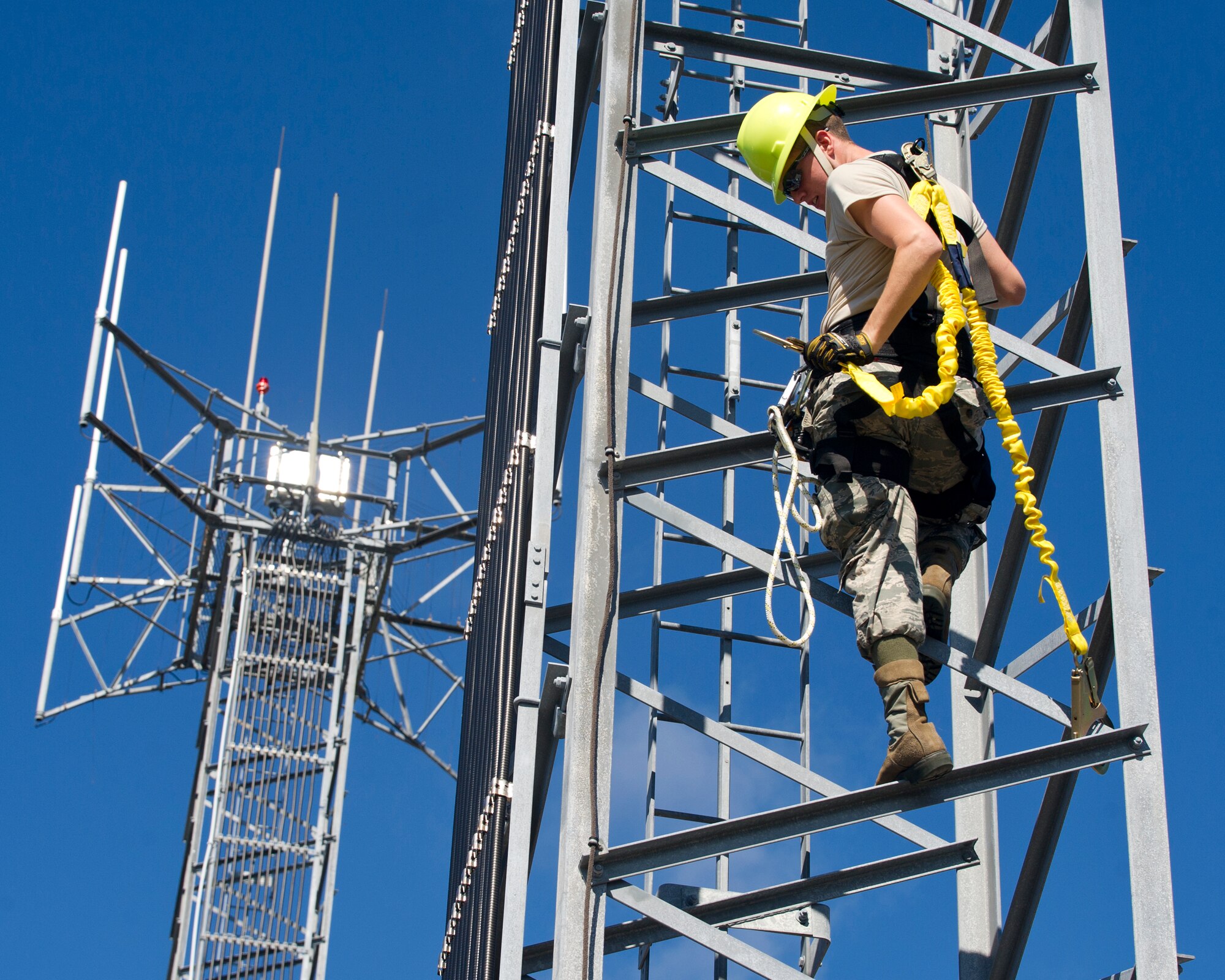 Senior Airmen Travis Nix, 325th Operations Support Squadron air field systems technician, climbs a 40 ft. receiver tower Nov. 12 at Tyndall, AFB. Technicians like Nix climb these towers to swap or repair antennas or to perform tower rescues. (U.S. Air Force photo by Senior Airman Alex Fox Echols III/Released)