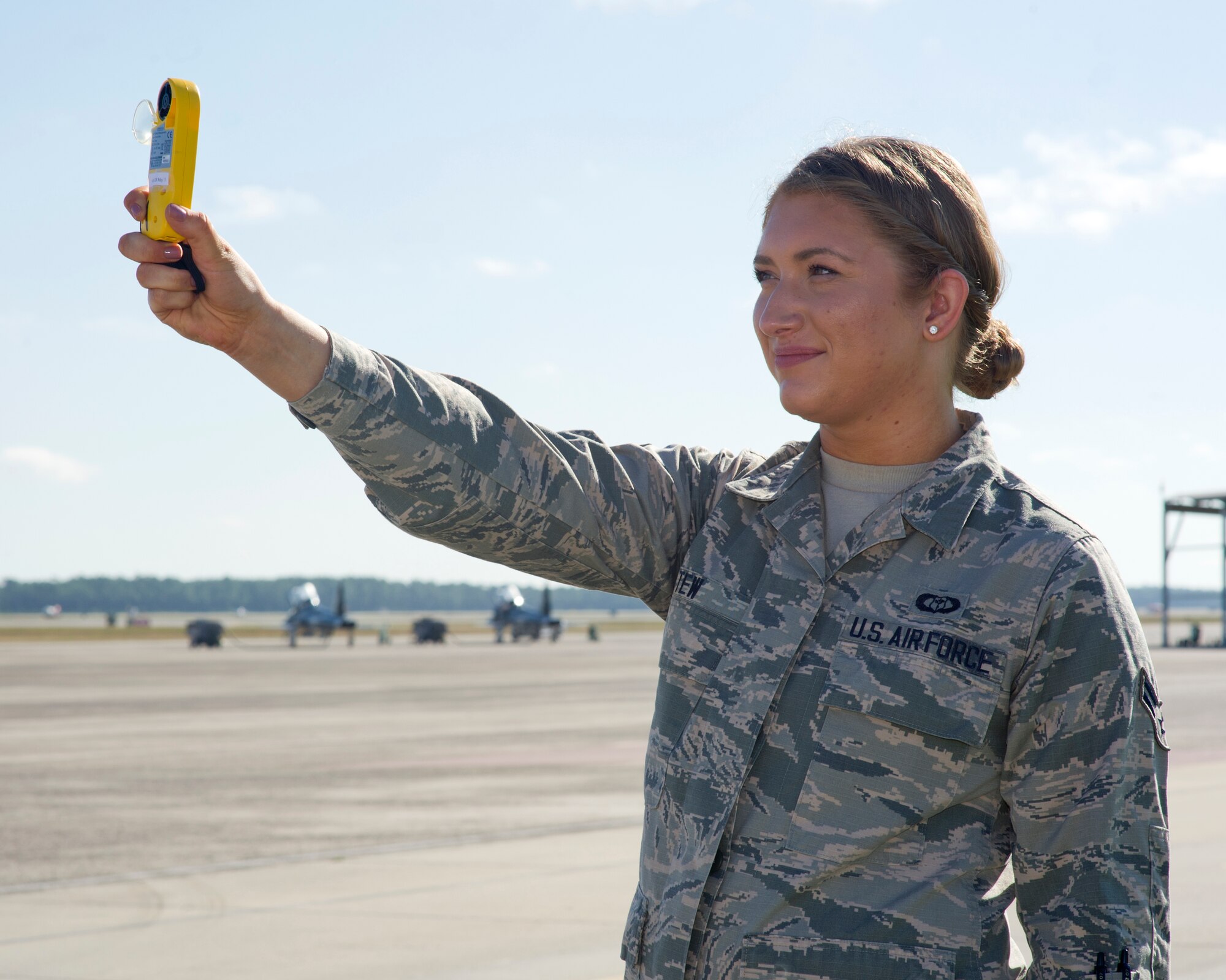 Airman 1st Class Alexandra Tew 325th Operations Support Squadron weather forecaster apprentice, takes manual weather readings Nov. 12 on Tyndall’s flightline. The weather flight tracks and monitors local weather to ensure no flights take off or land in dangerous conditions. (U.S. Air Force photo by Senior Airman Alex Fox Echols III/Released)