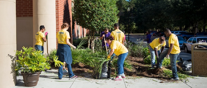 Joint Base Charleston members participate in a Day of Caring with students November 13, 2015, at West Ashley High School in West Ashley, S.C. Over 3,800 members from Joint Base Charleston joined Trident United Way’s Day of Caring volunteer event to assist three of the local counties—Berkeley, Charleston and Dorchester. Ten volunteer projects, mostly at public schools, totaled over 5,000 volunteer hours giving back to local communities. (U.S. Air Force photo/Airman 1st Class Clay Cupit)
