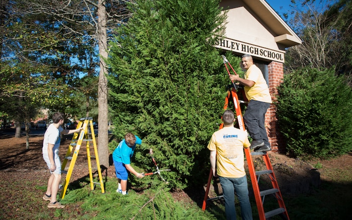 Joint Base Charleston members participate in a Day of Caring with students November 13, 2015, at West Ashley High School in West Ashley, S.C. Over 3,800 members from Joint Base Charleston joined Trident United Way’s Day of Caring volunteer event to assist three of the local counties—Berkeley, Charleston and Dorchester. Ten volunteer projects, mostly at public schools, totaled over 5,000 volunteer hours giving back to local communities. (U.S. Air Force photo/Airman 1st Class Clay Cupit)