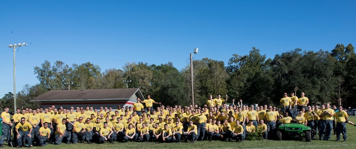 Joint Base Charleston members help out at the Young Men’s Christian Association in Summerville, S.C.,  during the Day of Caring event on Nov. 13, 2015. The Day of Caring had multiple events in the local tri-county area where JB Charleston members volunteered their time to help weed, rebuild, maintain, fix and repaint. Additionally, the volunteers restored a local butterfly garden, planted trees, rebuilt fences and much more. (U.S. Air Force photo/Airman 1st Class Thomas T. Charlton)