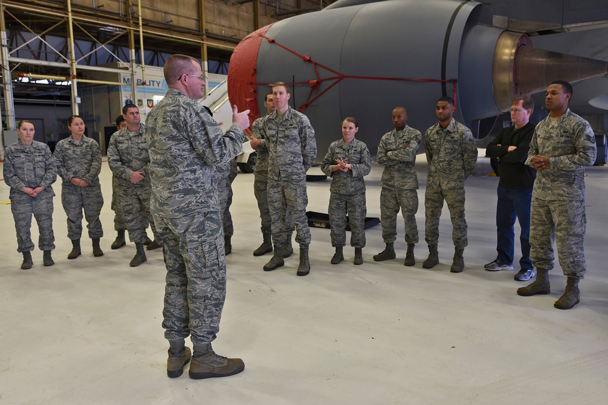 Lt. Col. James Dorn, 92nd Aircraft Maintenance Squadron commander, discusses the KC-135 Stratotanker and its mission with 92nd Comptroller Squadron personnel Nov. 19, 2015, at Fairchild Air Force Base, Wash. The KC-135 that was shown during the tour, rolled off the manufacturing line in 1961. (U.S. Air Force photo/Airman 1st Class Mackenzie Richardson)