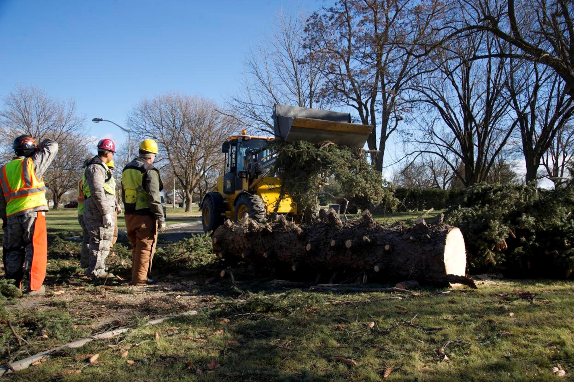 Airmen from the 92nd Civil Engineer Squadron provide clean-up efforts Nov. 18, 2015, at Fairchild Air Force Base, Wash. The base experienced a severe wind storm with gusts reaching 71 miles per hour, almost hurricane force. The Airmen provided clean-up for uprooted trees and fixed damage across the base. (U.S. Air Force photo/Airman 1st Class Nick J. Daniello) 
