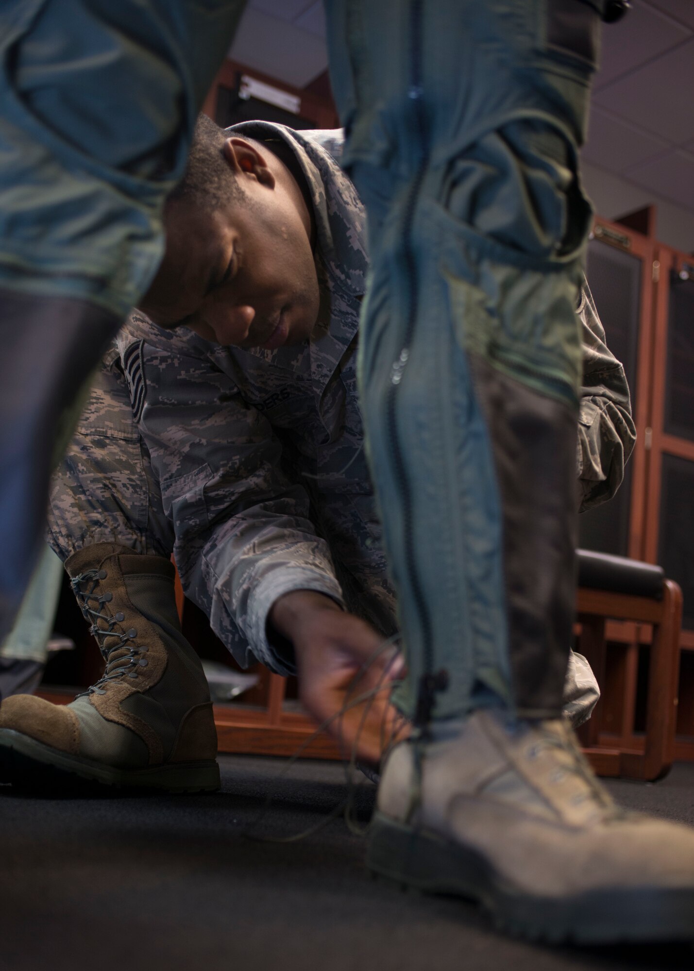 U.S. Air Force Tech. Sgt. Nicholas Sanders, an air crew flight equipment craftsman assigned to the 1st Operation Support Squadron adjusts a CSU-13B/P Anti-G Suit the at the 71st Fighter Squadron at Langley Air Force Base, Va., Nov. 17, 2015. The AFE Airmen maintain the equipment required of more than 40 pilots. (U.S. Air Force photo by Staff Sgt. J.D. Strong II)