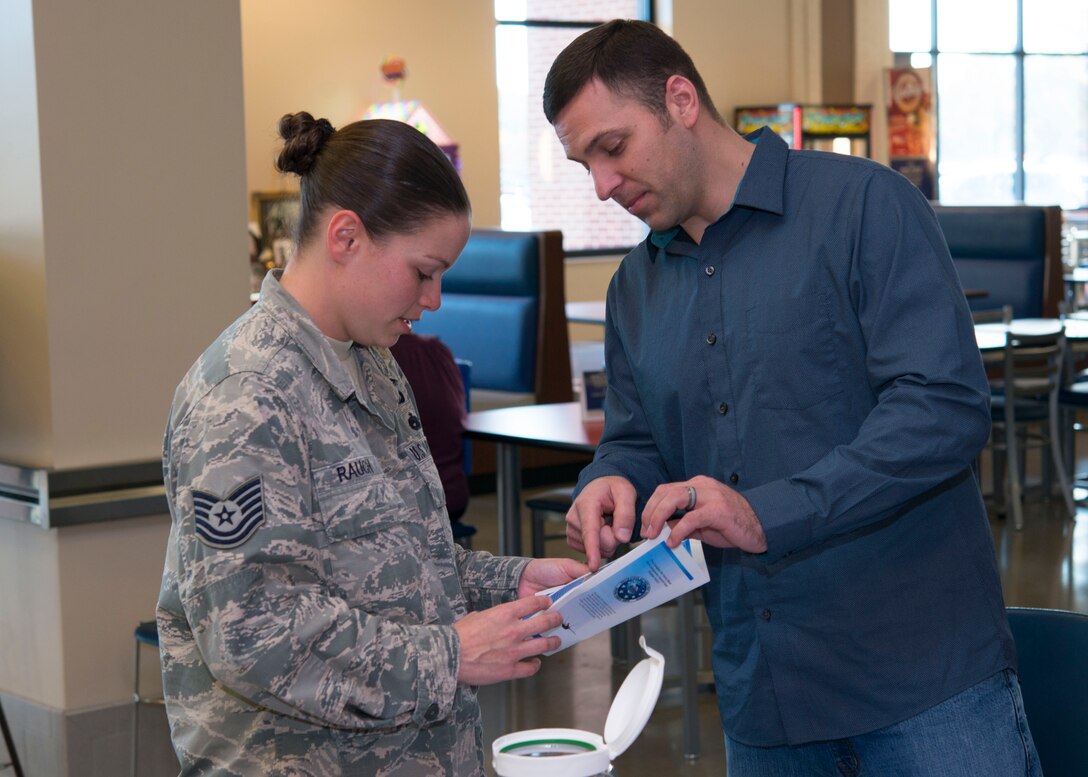 U.S. Air Force Tech. Sgt. Andrew, a security manager assigned to the 497th Operation Support Squadron, explains Operation Warmheart to Tech. Sgt. Rauch, a special programs manager assigned to the 480th Intelligence Surveillance and Reconnaissance Wing, at the Exchange at Langley Air Force Base, Va., Nov. 16, 2015. The Langley First Sergeant Council hosts the Operation Warmheart Thanksgiving Basket Drive annually, to assist Joint Base Langley-Eustis families.
(U.S. Air Force photo by Staff Sgt. J.D. Strong II)
