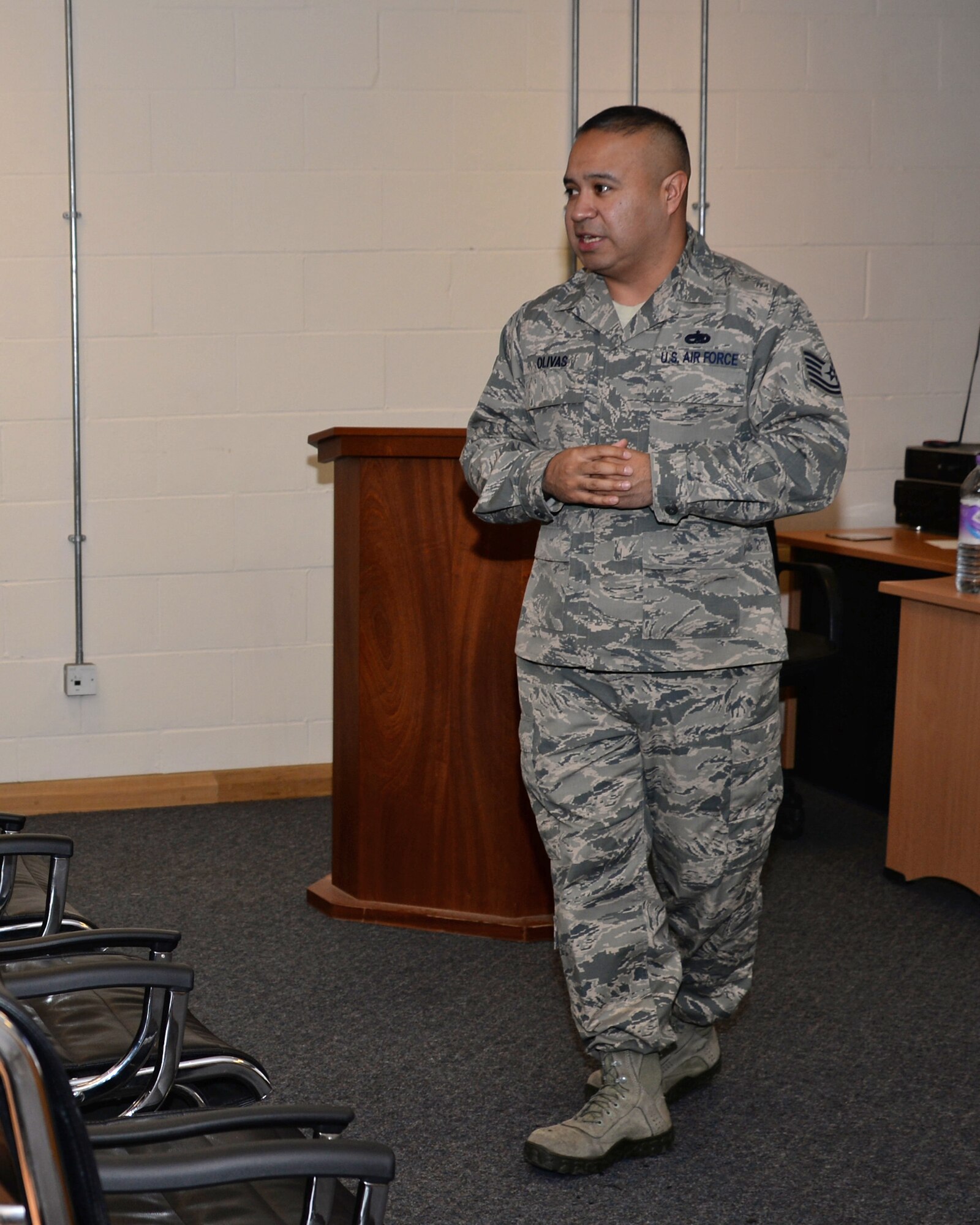 U.S. Air Force Tech Sgt. Ruben Olivas, 100th Maintenance Group maintenance training instructor briefs flightline regulations and procedure to Airmen Nov. 19, 2015, on RAF Mildenhall, England. Olivas was selected for the Square D Spotlight for portraying the core value of Excellence in All We Do. (U.S. Air Force photo by Senior Airman Christine Halan/Released)