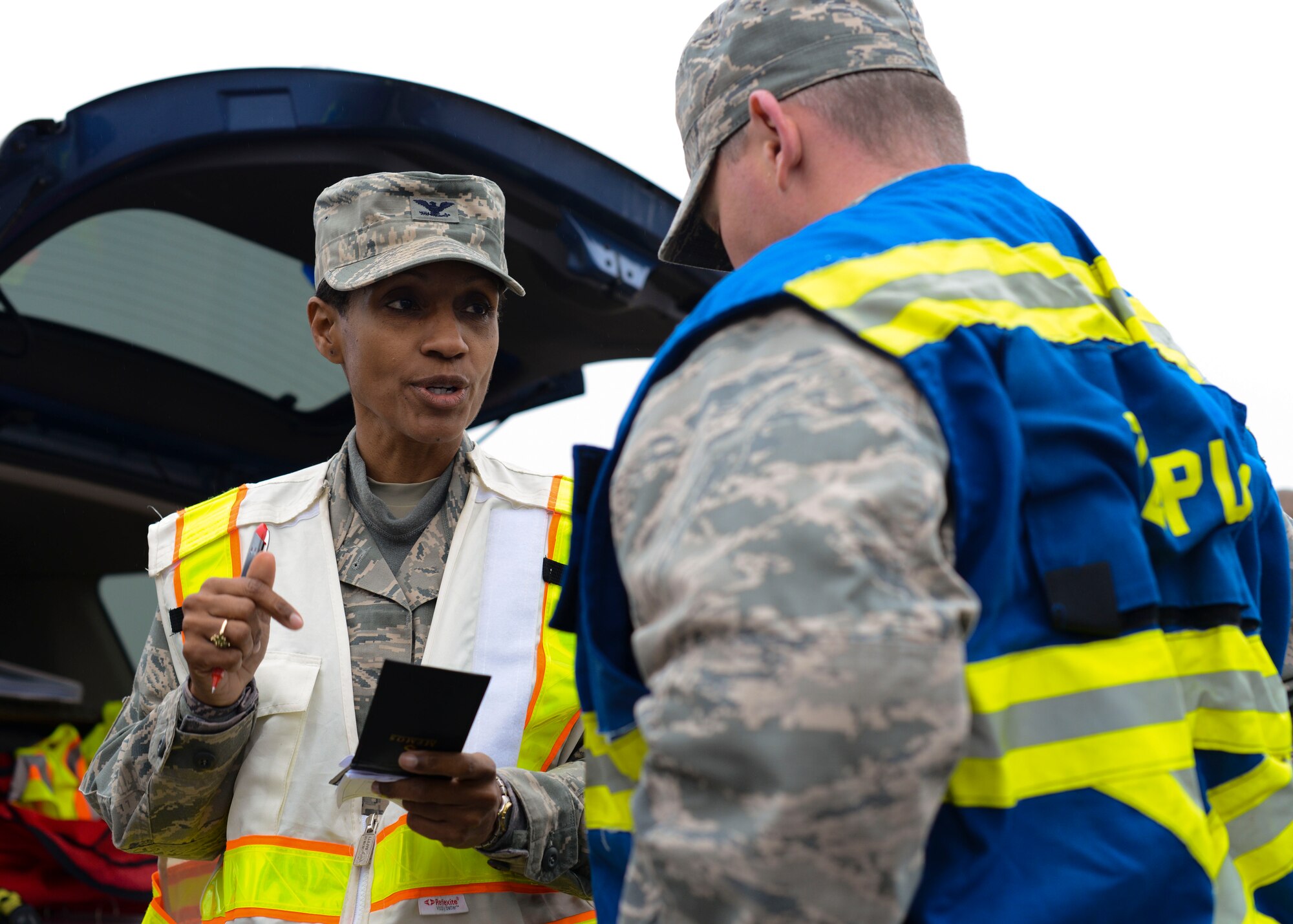 U.S. Air Force Col. Jenise Carroll, 31st Mission Support Group commander, speaks with Lt. Col. Dennis Phillips, 31st Civil Engineering Squadron commander, during a wing inspection, Nov. 17, 2015, at Aviano Air Base, Italy. The 31st Fighter Wing conducts in several inspections annually designed to identify and rectify deficiencies while highlighting best practices and outstanding performers. (U.S. Air Force photo by Senior Airman Austin Harvill/Released)