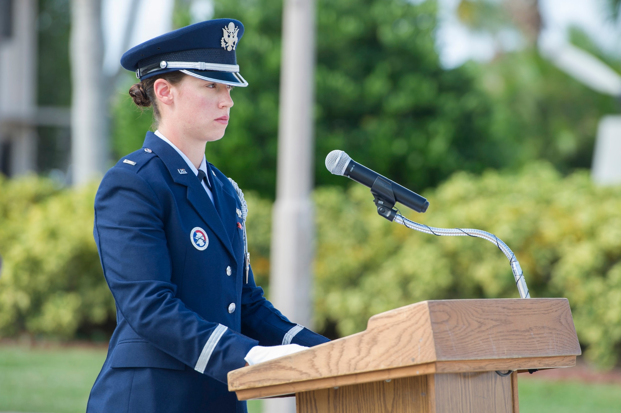 Second Lt. Carla Stapleton, Patrick Air Force Base Honor Guard member and range control officer for the 1st Range Operations Squadron, narrates during a military funeral honors demonstration held Nov. 17, 2015, at Patrick AFB, Florida. “Being able to serve on this team is a great honor. We represent five services to the public, and provide closure as well as an image of steadiness and strength to a grieving family. Performing military funeral honors requires numerous hours of practice. We can spend many hours practicing for a ceremony that will last five to 15 minutes,” said Stapleton. (U.S. Air Force photo by Matthew Jurgens/Released)