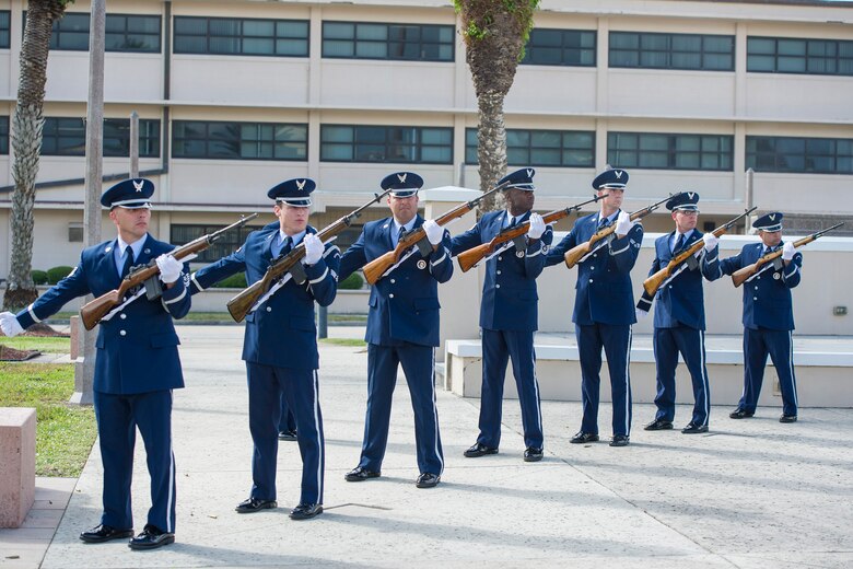 Patrick Air Force Base Honor Guard members fire three volleys during a demonstration for the base Nov. 17, 2015, at Memorial Plaza at Patrick AFB, Florida. During the demonstration, the honor guard conducted a full military funeral honors ceremony, which included a 20-person team that performed pallbearing, a six-person flag fold, a color guard, a firing party, the playing of Taps, and a flag presentation. (U.S. Air Force photo by Matthew Jurgens)