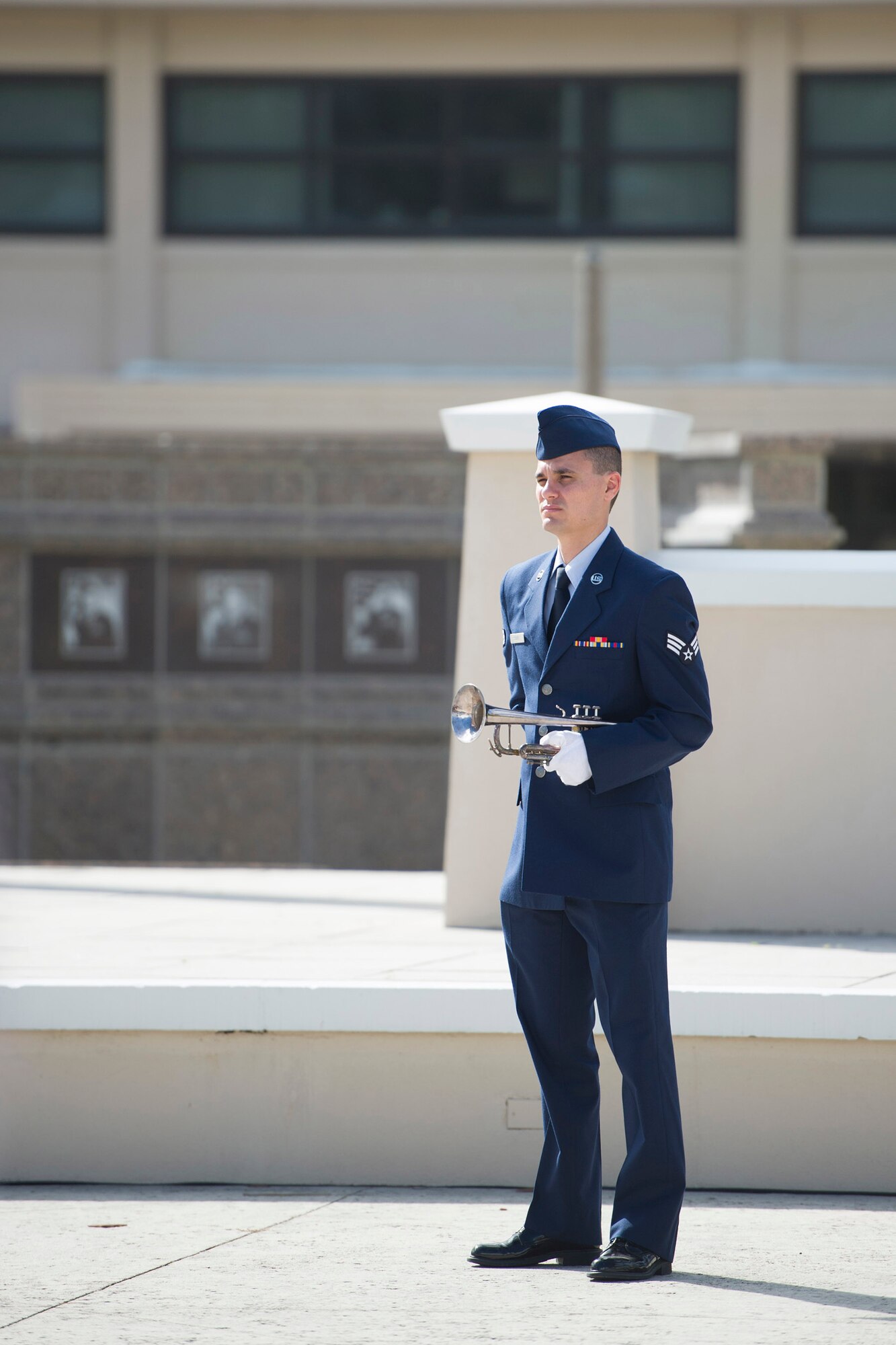 Senior Airman Robert Scott, Air Force Technical Applications Center, stands ready to play Taps for the Patrick Air Force Base Honor Guard demonstration Nov. 17, 2015, at the Memorial Plaza at Patrick AFB, Florida. Taps was composed by Gen. Daniel Butterfield and, when played during a funeral, represents the extinguishing of a life. (U.S. Air Force photo by Matthew Jurgens/Released)