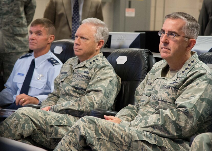General John E. Hyten, commander of Air Force Space Command, right, and Lt. Gen. John Thompson, commander of Air Force Life Cycle Management Center, center, and Maj. Gen. Craig Olson, C3I and Networks program executive officer, attend a Hanscom Collaboration and Innovation Center capabilities demonstration Nov. 16 at Hanscom Air Force Base, Mass. Hyten, in the area for a multi-day visit, received briefings from Hanscom’s program executive officers, visited MIT Lincoln Laboratory and toured New Boston Air Force Station, N.H., and Cape Cod Air Force Station, Mass., both of which are Air Force Space Command assets. (U.S. Air Force photo by Mark Herlihy)