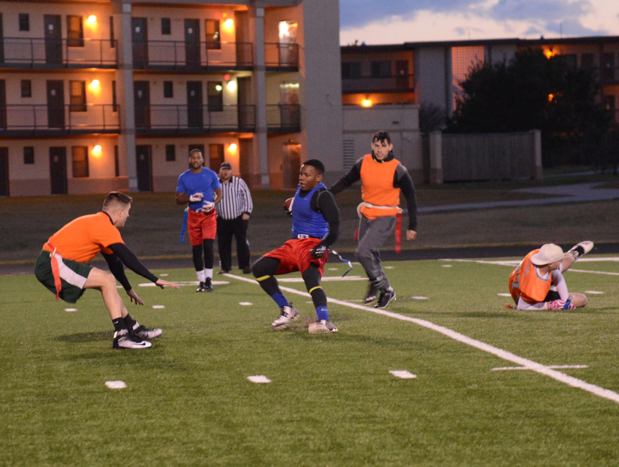 Tre Williams from the Med Group flag football team dodges players from the 552nd Maintenance Group during one of the Nov. 17 playoff games. Scores for all four games were: Med Group beat 552nd MXS 19-0; Reserve Gold downed Reserve White, 3-0; 552nd Aircraft Maintenance Squadron shut out Security Forces 16-0; and Reserve Gold beat Med Group, 14-0. (Air Force photo by Kelly White/Released)