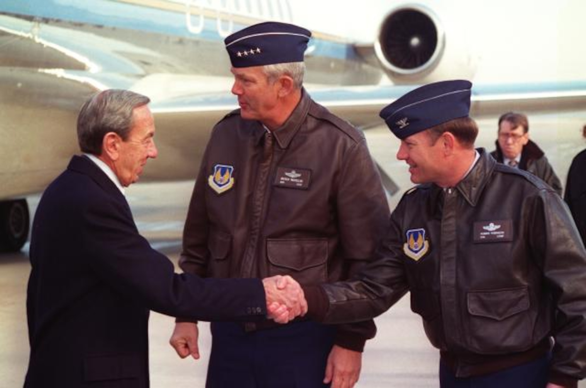 Col. Robbie Robinson, then-88th Air Base Wing commander, shakes then-Secretary of State Warren Christopher's hand as he and then-Air Force Materiel Command commander Gen. Henry Viccellio welcome members of the U.S. Department of State to Wright-Patt AFB for the Dayton Peace Accords. (courtesy photo)
