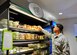 Airman 1st Class Jorge Rijo, a 436th Aerospace Medicine Squadron bioenvironmental engineer, grabs a to-go fruit cup during the soft opening of the Patterson Dining Facility on Nov. 17, 2015, at Dover Air Force Base, Del. The dining facility now offers grab and go items outside of normal operating hours. (U.S. Air Force photo/Senior Airman William Johnson)