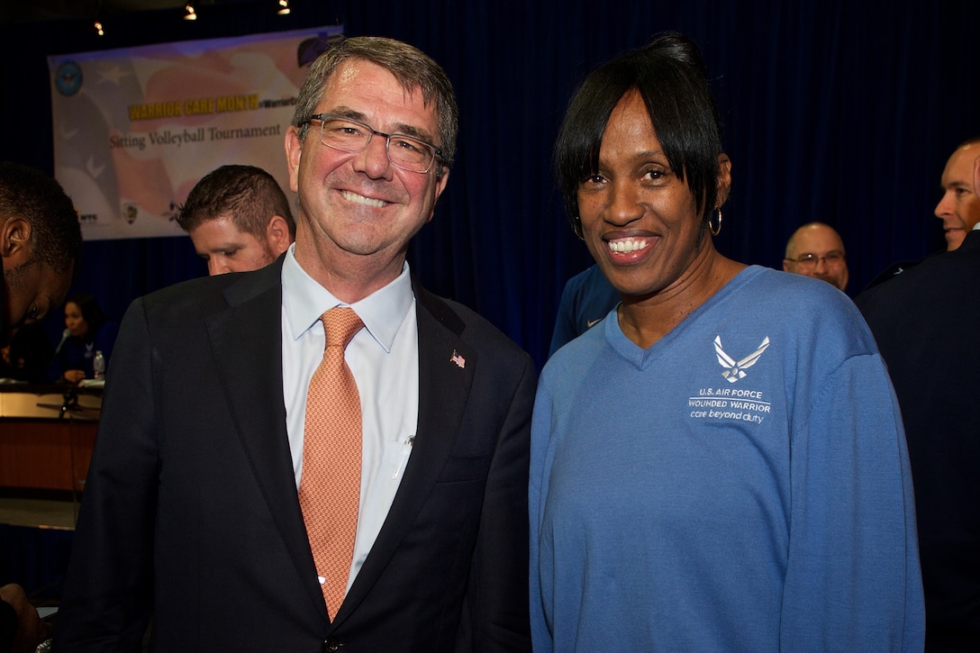 Defense Secretary Ash Carter poses with Gold Medal Olympian Jacki Joyner-Kersee at the Warrior Care Month Sitting Volleyball Tournament at the Pentagon, Nov. 19, 2015. DoD photo by Casper Manlangit