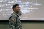 Louisiana National Guards Lt. Col. Henry T. Capello, chief communications officer, conducting training for the Cyber Defense Incident Response Team (CDIRT). To practice looking for potential security breaches during training, members of the Louisiana Army and Air National Guard who are on the CDIRT log onto computers  formatted to duplicate common operating systems and website platforms and look for unusual activity that may indicate that a hacker is actively compromising a state website. 