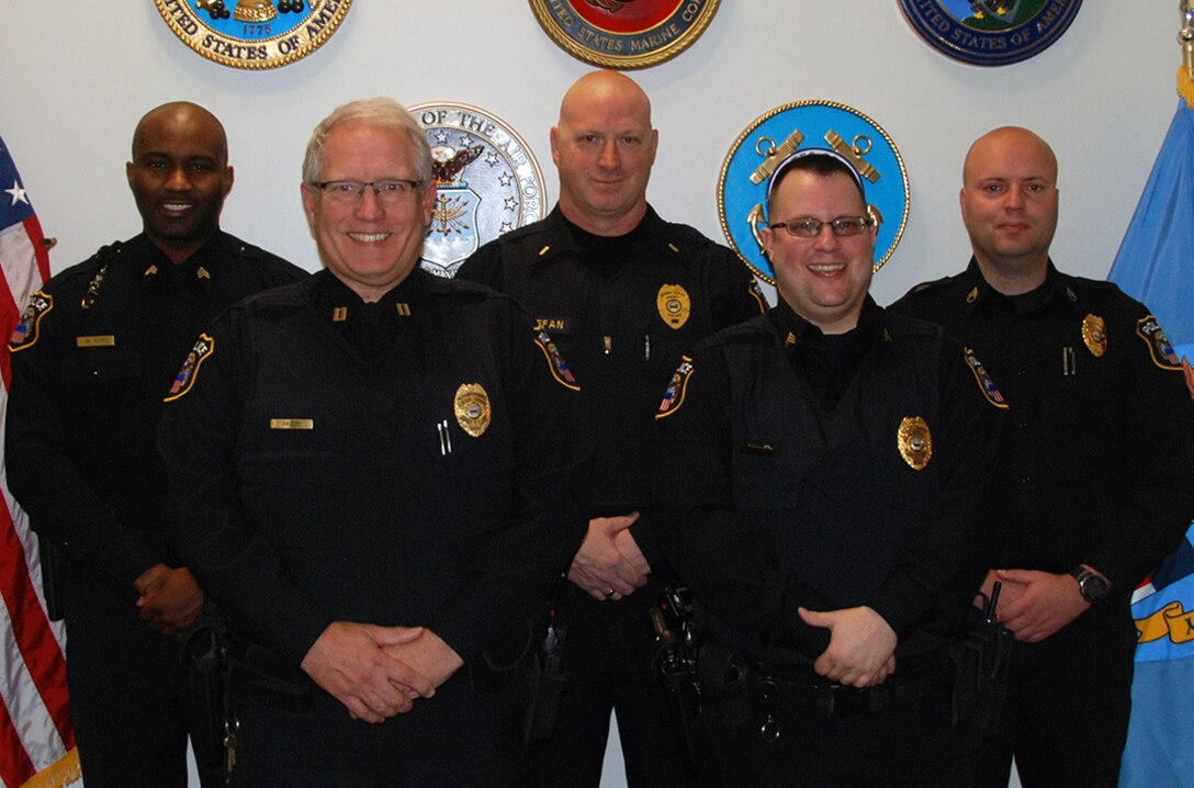 (From left) Defense Logistics Agency Police officers -- Sgt. William Epps; Capt. Gary Giseke; Lt. Mark Stefan; Sgt. Jason Carey and Staff Sgt. David Young -- used an automated external defibrillator to save the life of a DLA employee that was having a heart attack Nov. 2 at the McNamara Headquarters Complex.