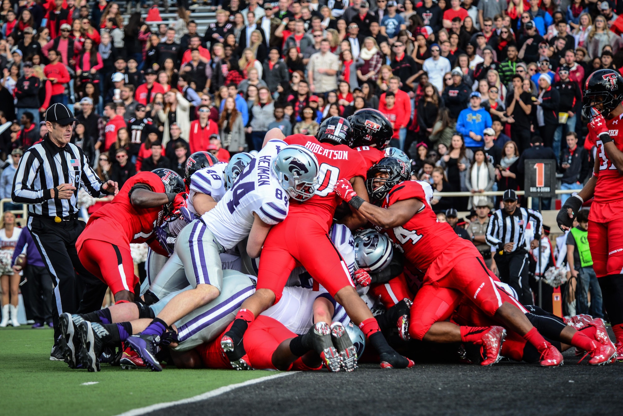 Texas Tech defenders block a Kansas State touchdown attempt Nov. 14, 2015, in Lubbock, Texas. The TTU home game against Kansas State was their “Celebrating America” appreciation game, marking the school’s gratitude and respect for military and first responders. (U.S. Air Force photo/Airman 1st Class Shelby Kay-Fantozzi)