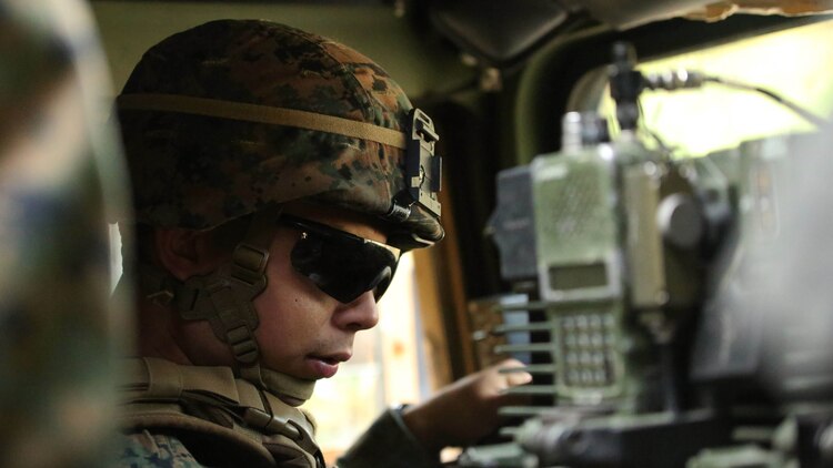 A Marine with Combined Anti-Armor Team, 3rd Battalion, 2nd Marine Regiment, conducts a functions check on a Humvee during a patrol training exercise at Marine Corps Base Camp Lejeune, North Carolina, Nov. 16, 2015. The unit practiced patrolling techniques both on foot and mounted in Humvees in preparation for their upcoming deployment to Okinawa, Japan. 
