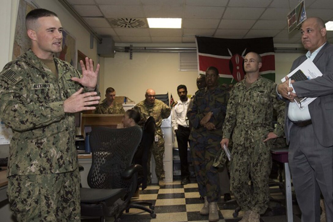Officials get an introduction to the Fusion Action Cell at Camp Lemonnier, Djibouti, Oct. 27, 2015. The FAC is comprised of service members from the U.S., Europe and East Africa working together to setup military-to-military projects and civilian support initiatives in partner countries throughout the Horn of Africa. U.S. Africa Command photo