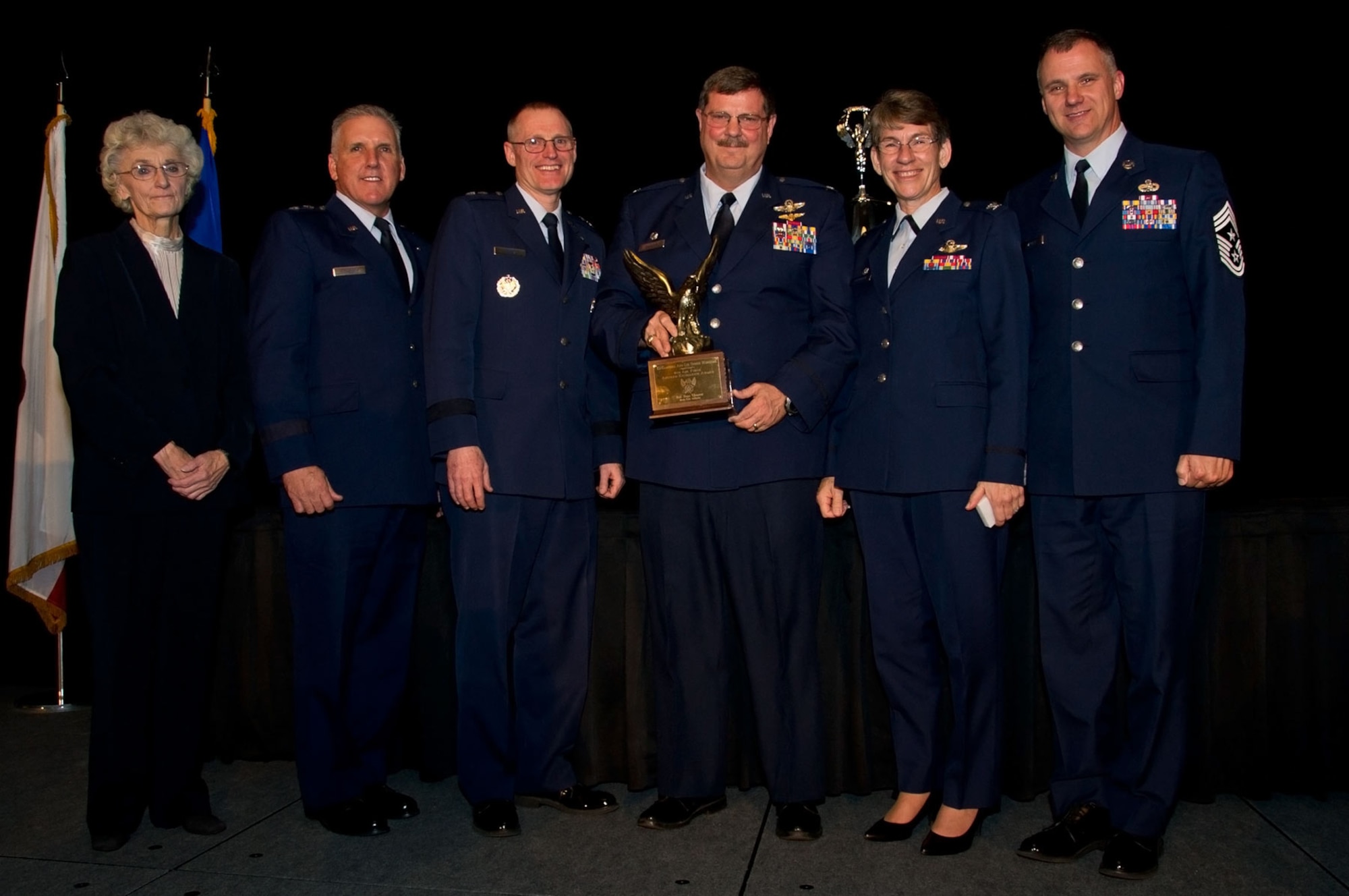 The 315th Airlift Wing, from Joint Base Charleston, South Carolina, was awarded the Aircrew Excellence Award  at March Air Reserve Base, Calif. Nov. 19.

In this photo (from left) retired Col. Nancy Driscoll, AFA Bob Hope Chapter president, Maj. Gen.John Flournoy, Jr.,  Fourth Air Force commander, Maj. Gen. Kenneth Lewis, Jr.,Director of Air, Space and Information Operations, Col. Gregory Gilmour, 315 AW commander, Col. Caroline Evernham, 315th Operations Group commander, and Chief Master Sgt. Mark Barber, 315 AW command chief stand with the Aircrew Excellence Award. (U.S. Air Force Photo by Senior Master Sgt. Keith Baxter)