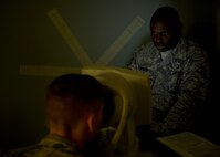 U.S. Air Force Staff Sgt. Terrence Brown Sr., 97th Medical Operations Squadron NCO in charge of optometry services performs an eye exam on a patient at the 97th Medical Group, Oct. 1, 2015 at Altus Air Force Base, Okla. The clinic screens for any type of condition within the eye, provides prescriptions and do repairs and fittings for glasses. If diagnosed, the clinic can treat some conditions on site. (U.S. Air Force photo by Airman 1st Class Megan E. Acs/Released